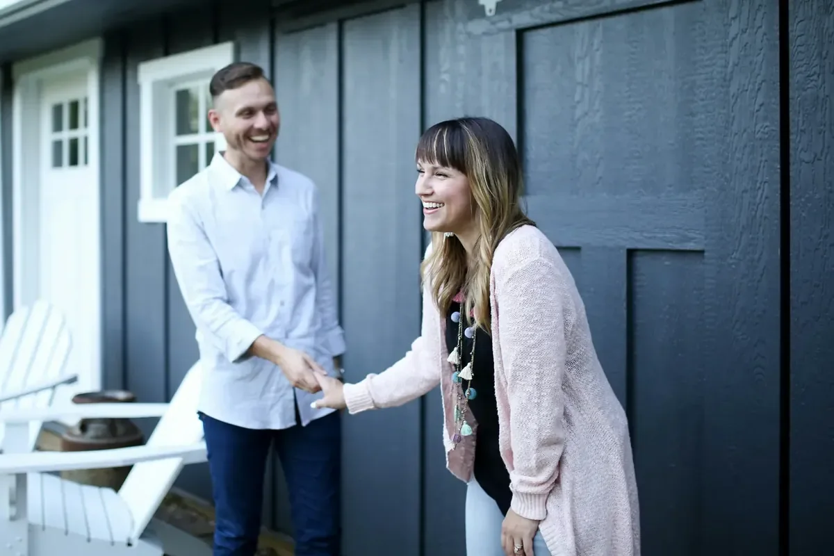 Couple at the door of their new home